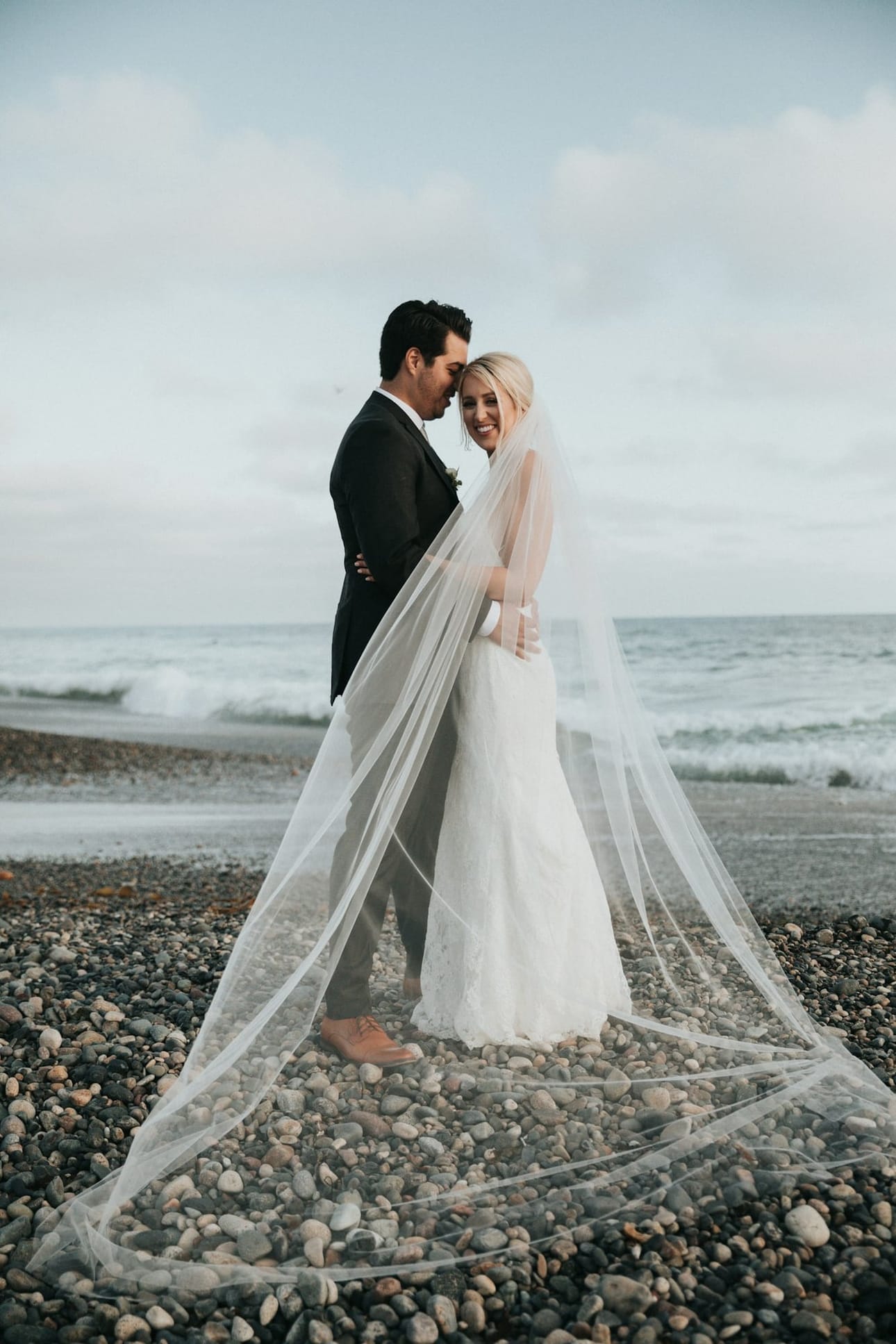 The couple sharing a quiet moment by the sea