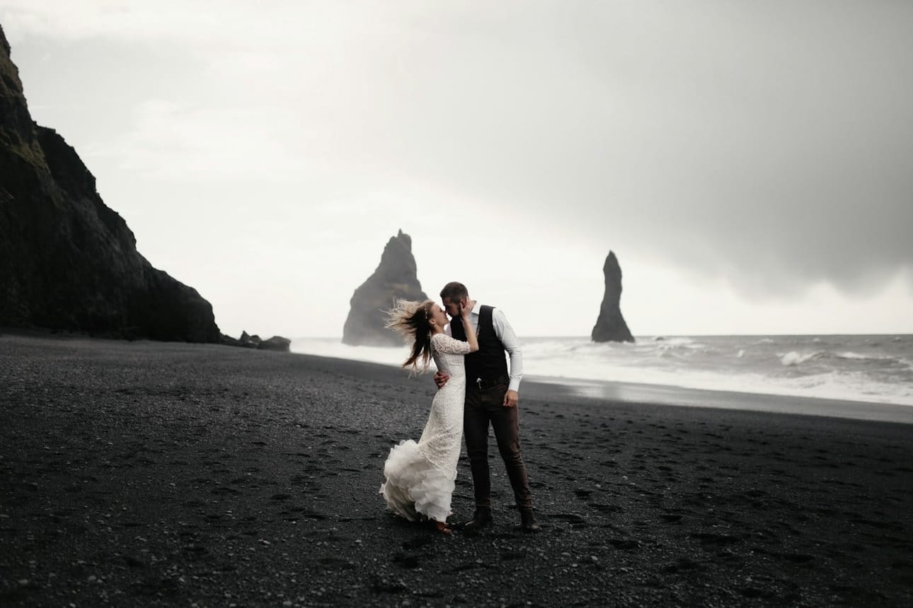 The couple on a black sand beach