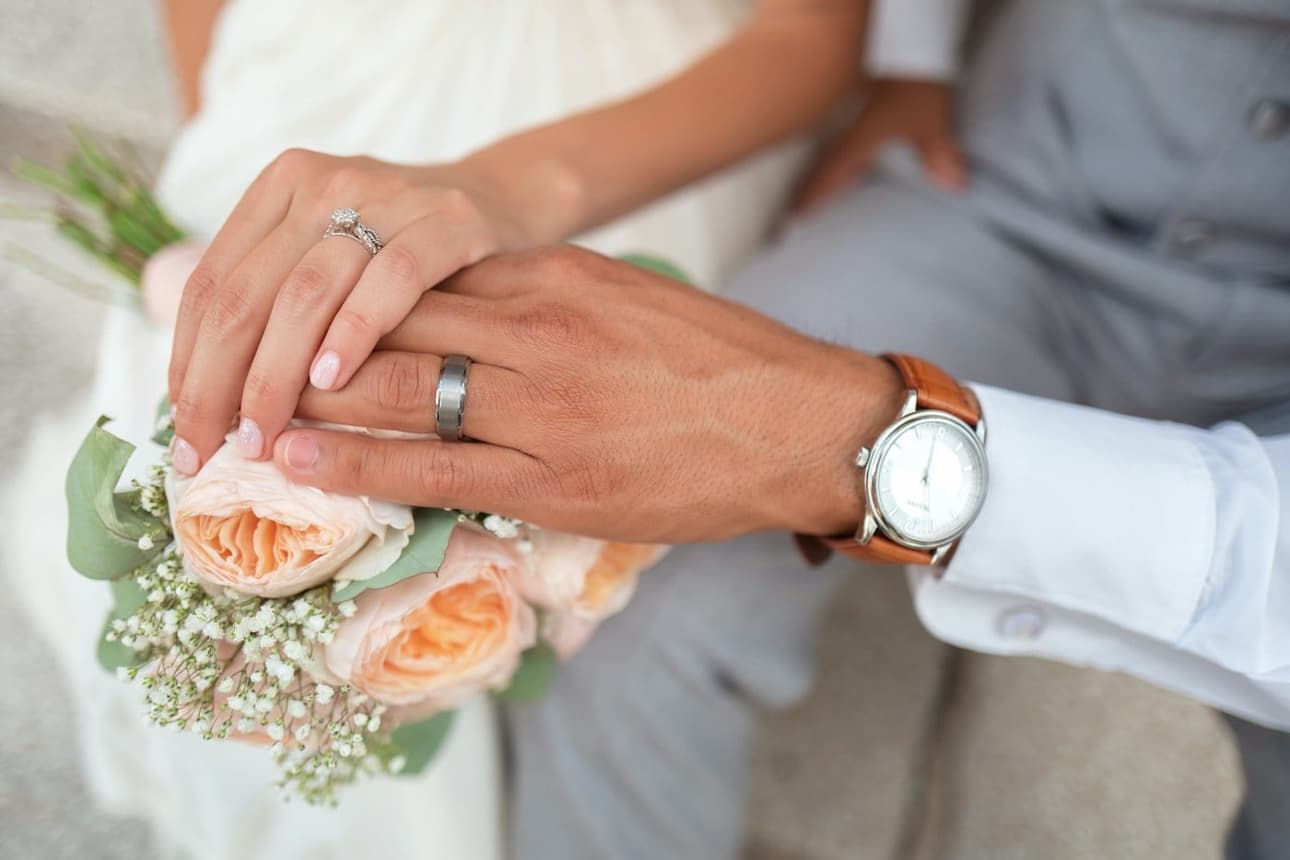 Hands with an engagement ring and watch